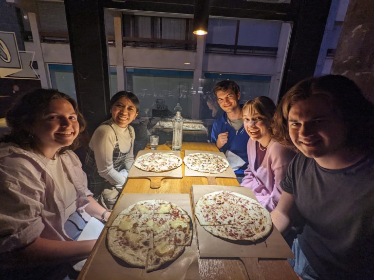 Scholars eating Pizza in France